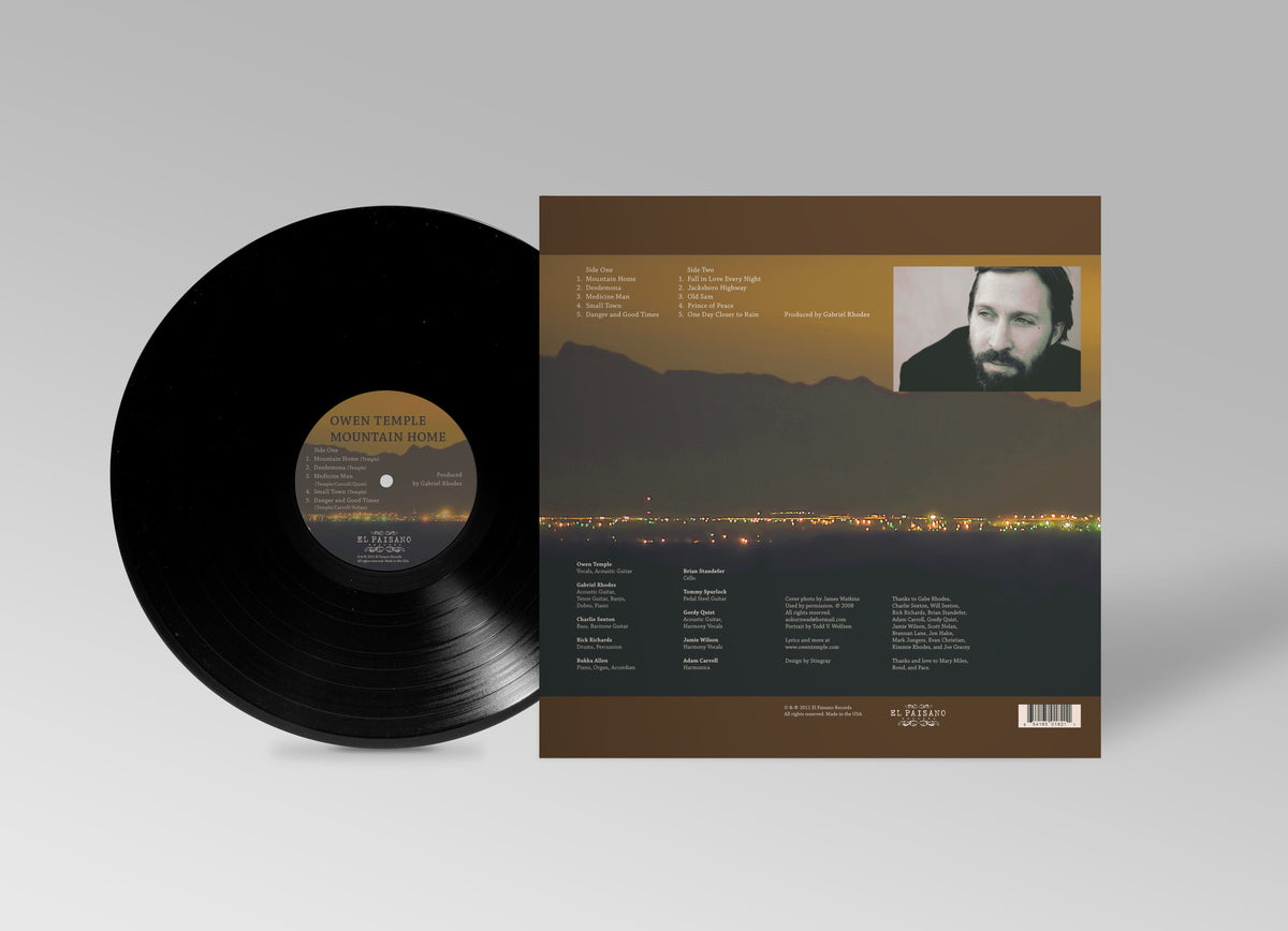 Mountain Home — back of the vinyl LP jacket with the record showing the Side One label: both sides' track lists, a portrait photograph, the players and the production credits over the night landscape